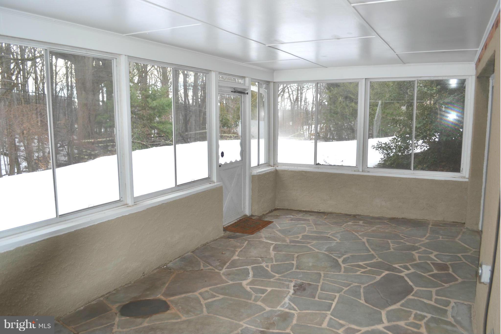 13423 Blenfield Road Phoenix, MD 21131 - Photo 28 of 30 Sunroom w/ flagstone flooring