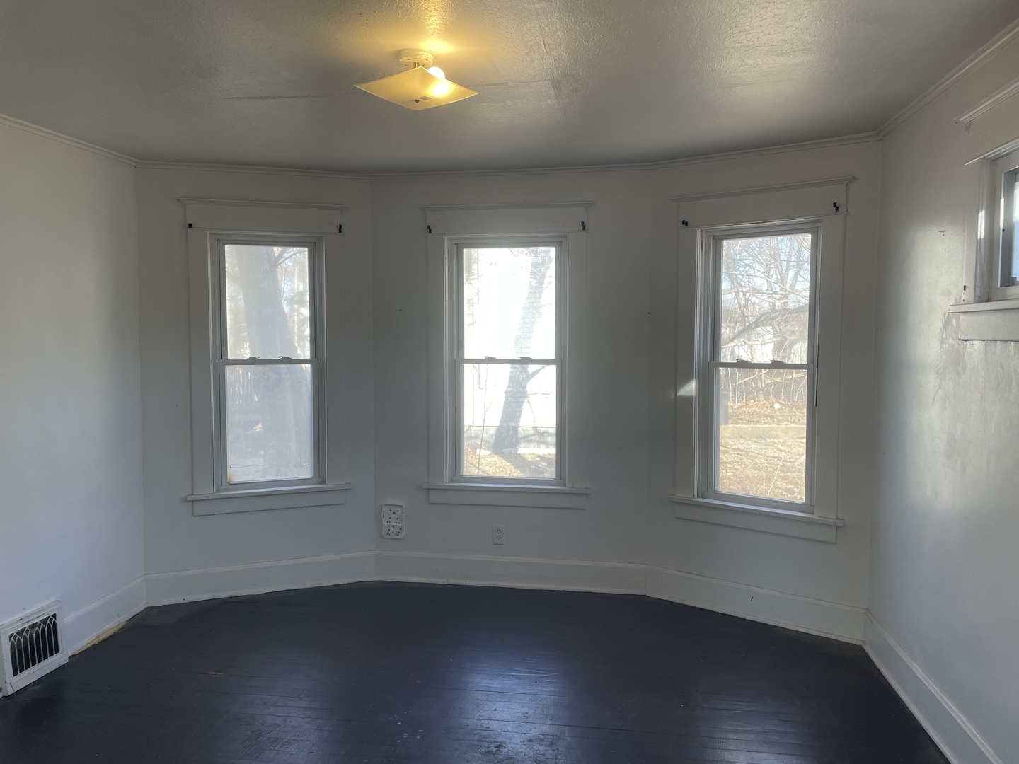 3116 11th Avenue Moline, IL 61265 - Photo 4 of 10 an empty room with wooden closet and windows