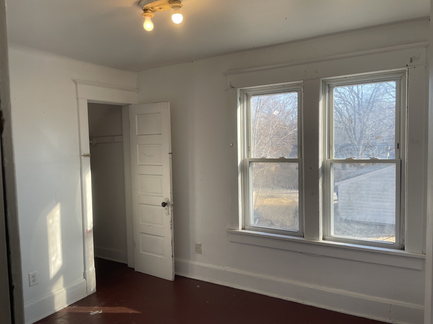 3116 11th Avenue Moline, IL 61265 - Photo 7 of 10 an empty room with wooden floor and windows