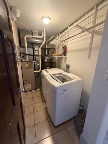a utility room with washer and dryer