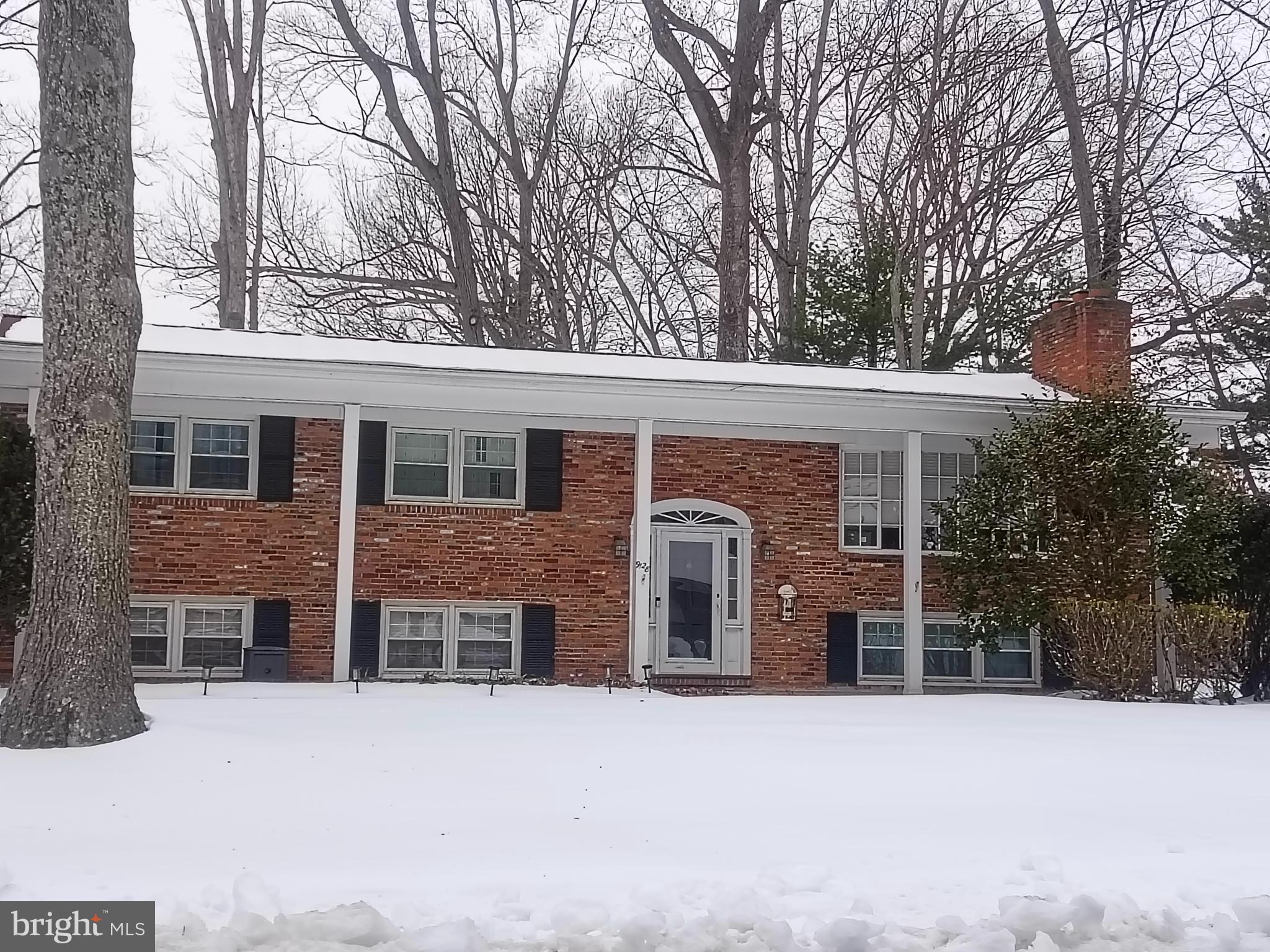 9128 Glenbrook Road Fairfax, VA 22031 - Photo 1 of 3 front view of a house with a yard