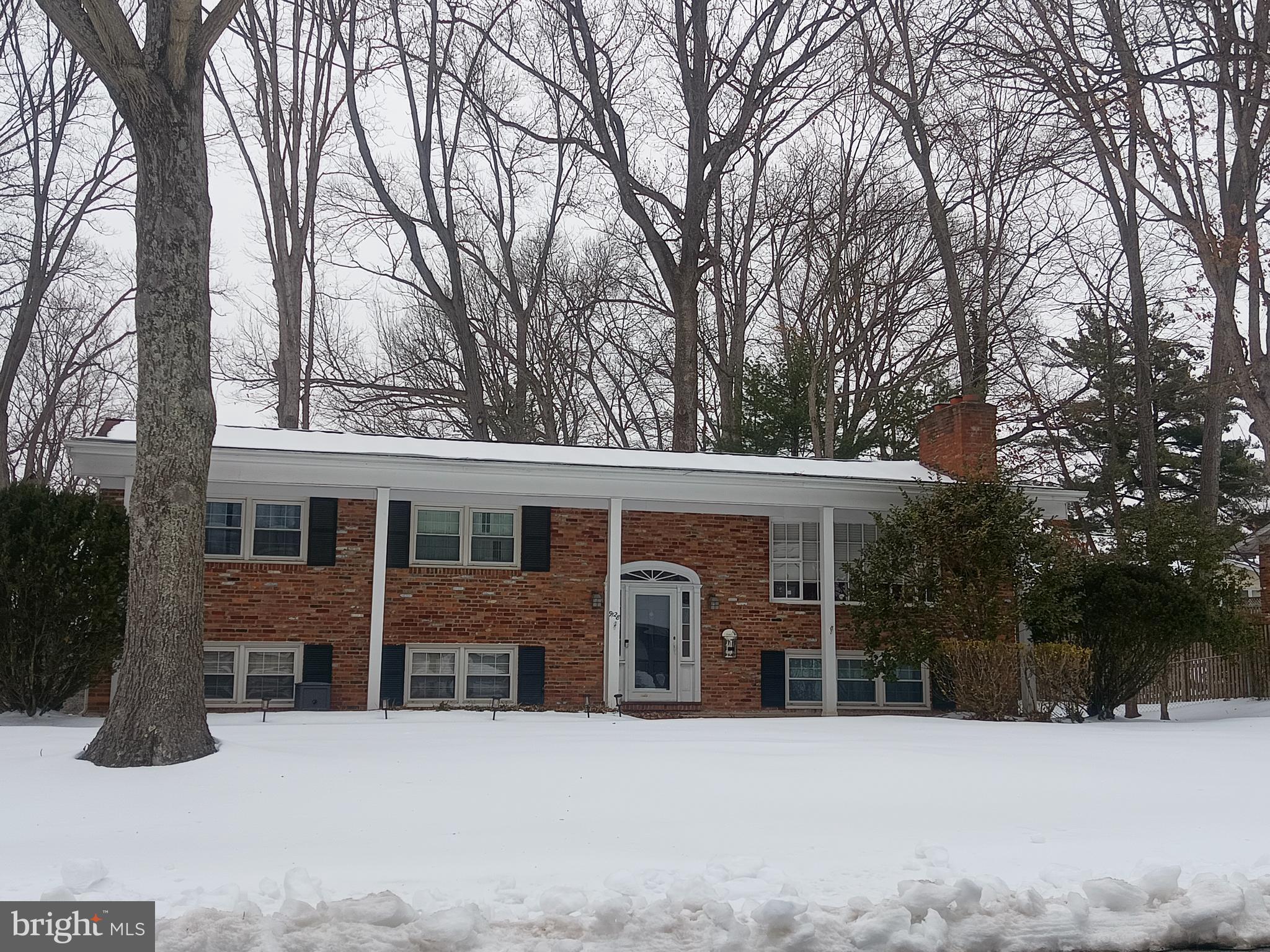 9128 Glenbrook Road Fairfax, VA 22031 - Photo 3 of 3 front view of a house with a yard