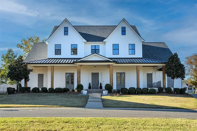 a front view of a house with swimming pool
