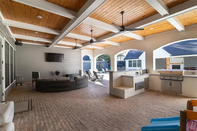 a living room with furniture and kitchen view