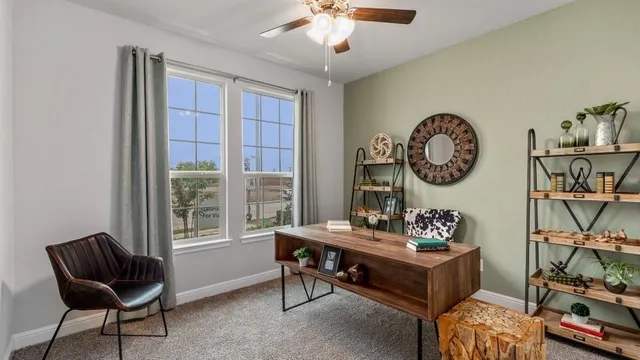 a en suite bathroom with 2 sink flowerpot and a mirror