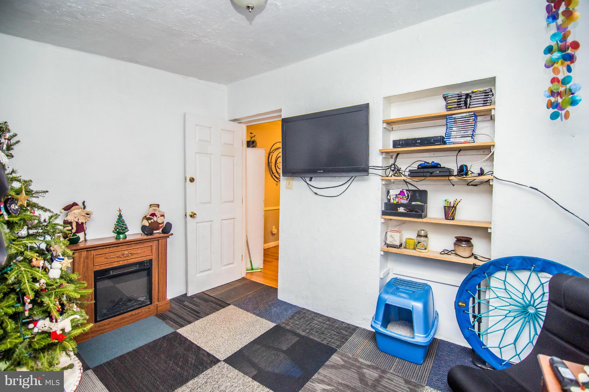 4708 Raspe Avenue Baltimore, MD 21206 - Photo 13 of 23 Main Lvl BR 2 w/ hardwood under carpet tile