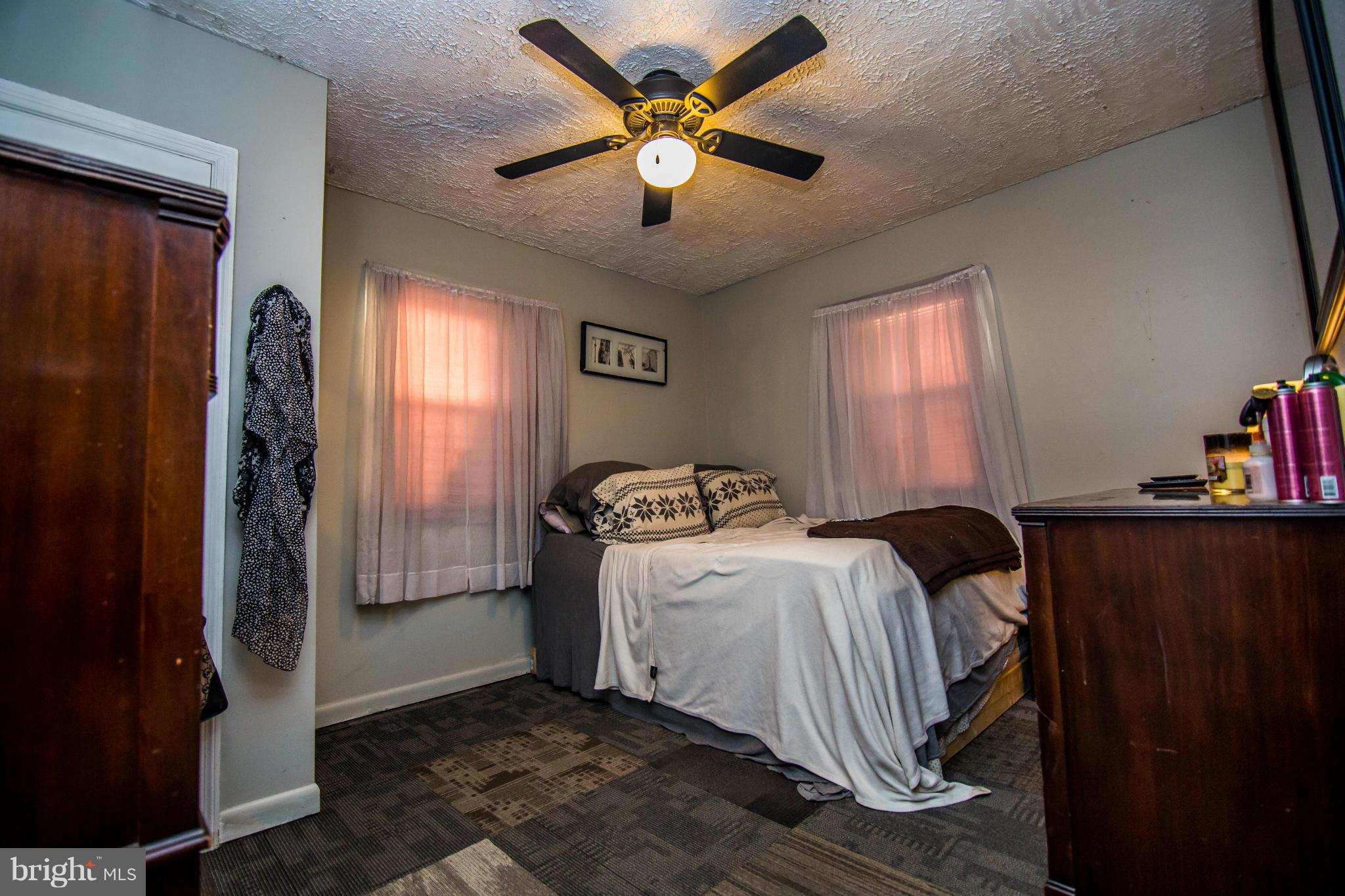4708 Raspe Avenue Baltimore, MD 21206 - Photo 8 of 23 Main Lvl Mstr BR w/ hardwood under carpet tile