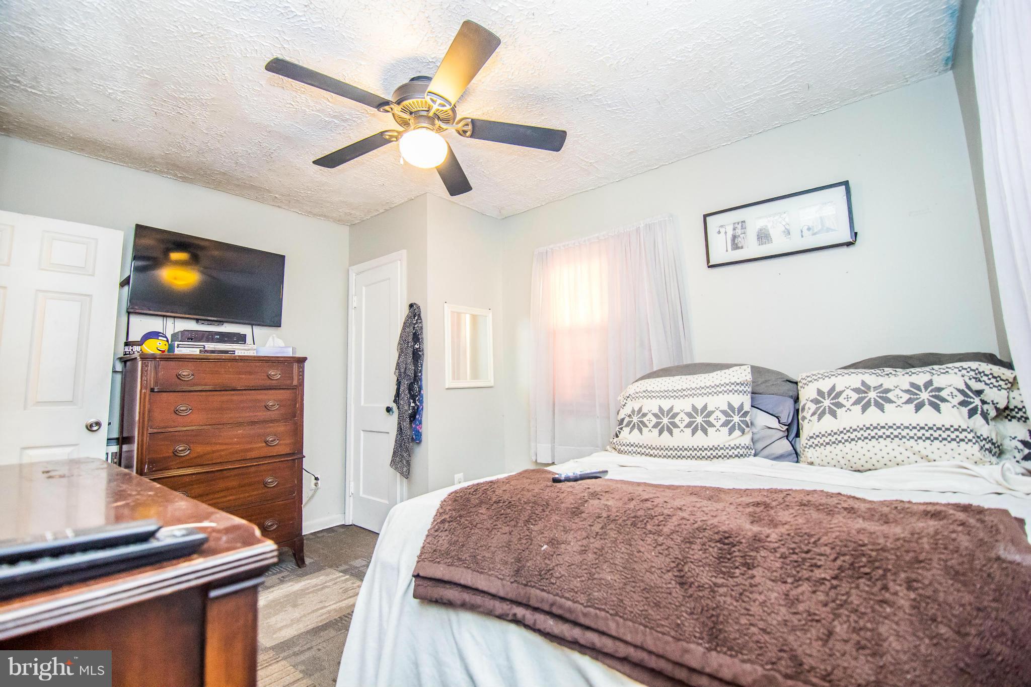 4708 Raspe Avenue Baltimore, MD 21206 - Photo 9 of 23 Main Lvl Mstr BR w/ hardwood under carpet tile