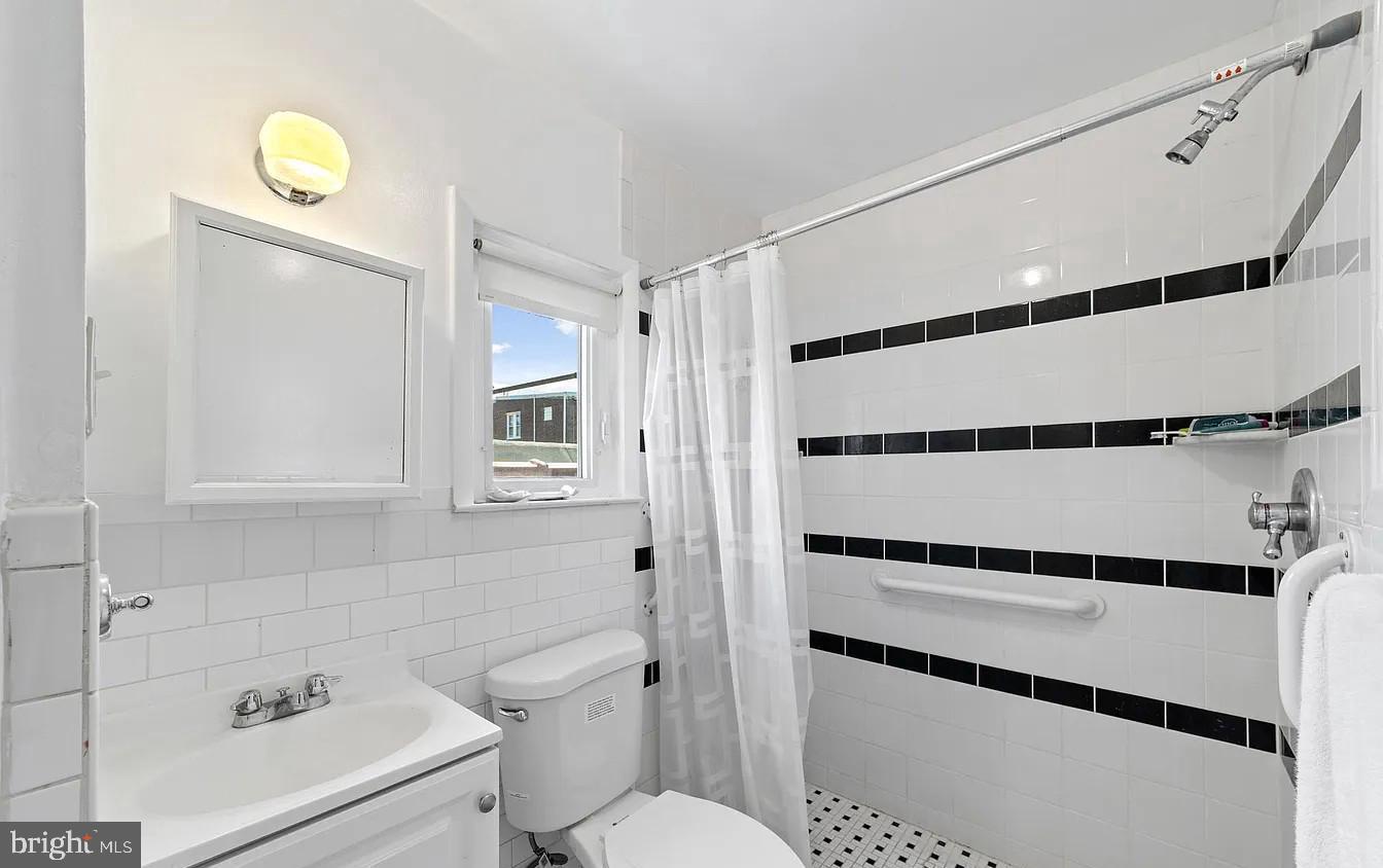 2329 Rhawn Street Philadelphia, PA 19152 - Photo 14 of 23 a bathroom with a sink a toilet and shower