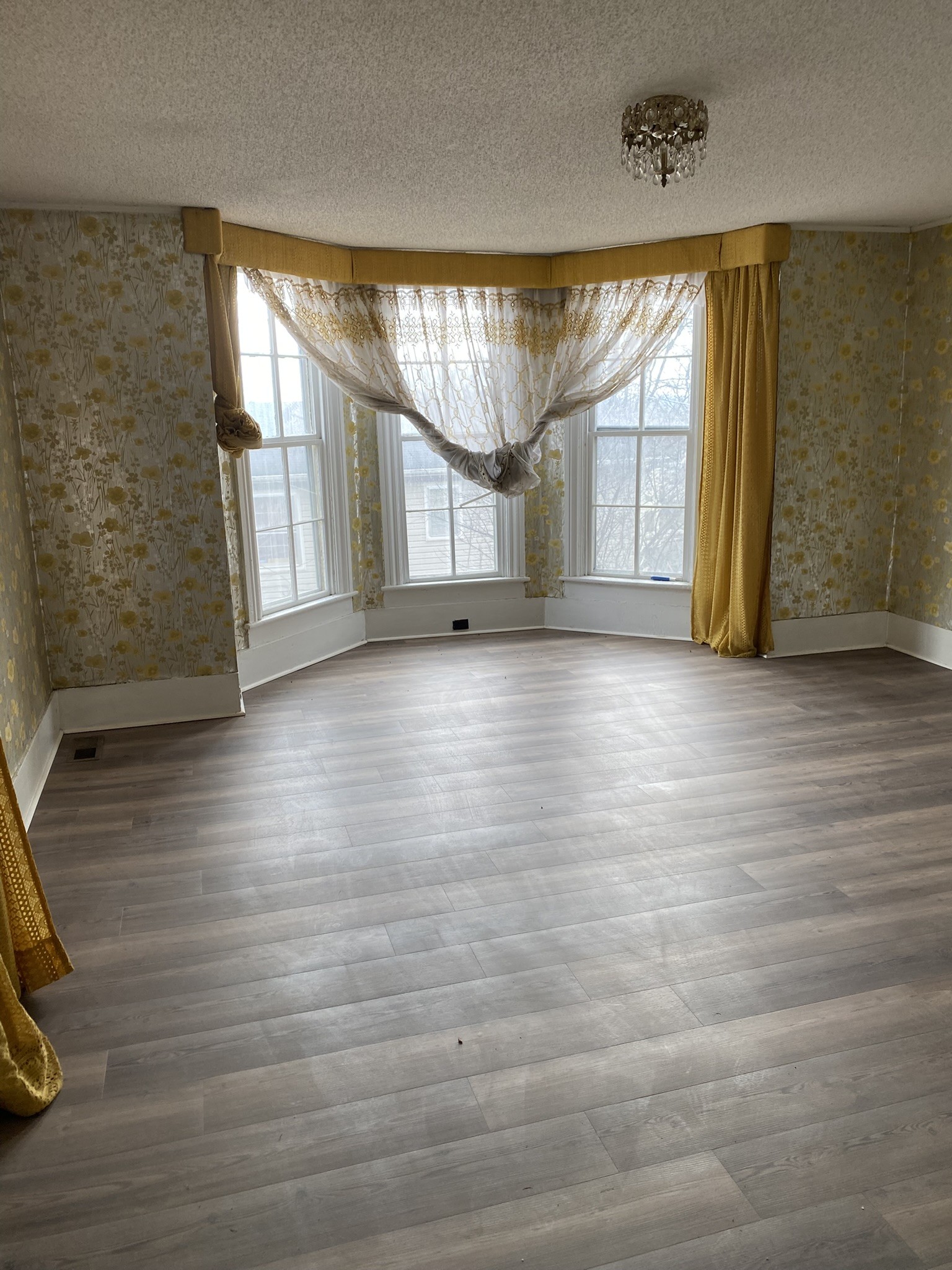 339 West Washington Street Pulaski, TN 38478 - Photo 13 of 23 wooden floor in an empty room with a window