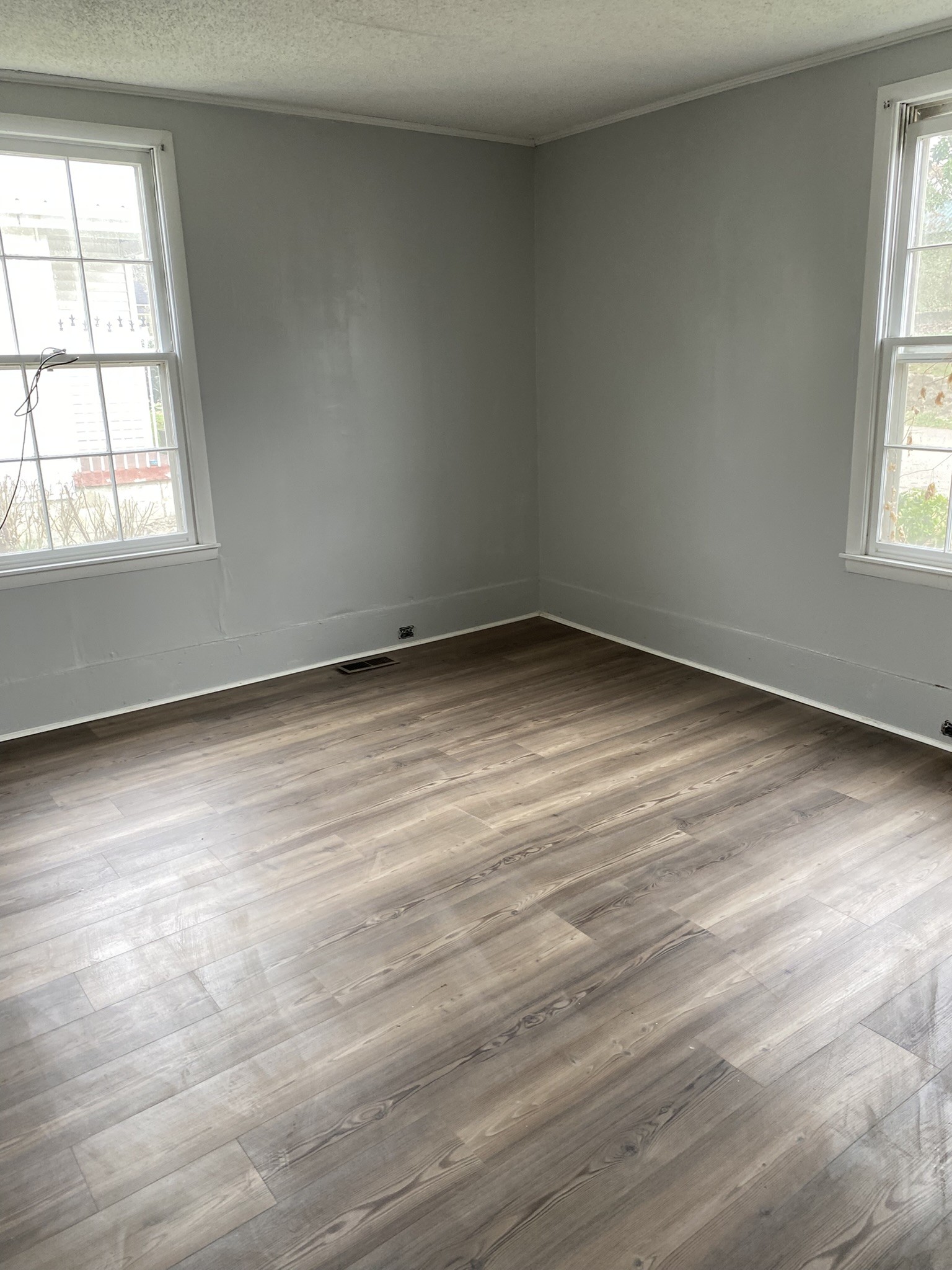 339 West Washington Street Pulaski, TN 38478 - Photo 16 of 23 an empty room with wooden floor and windows