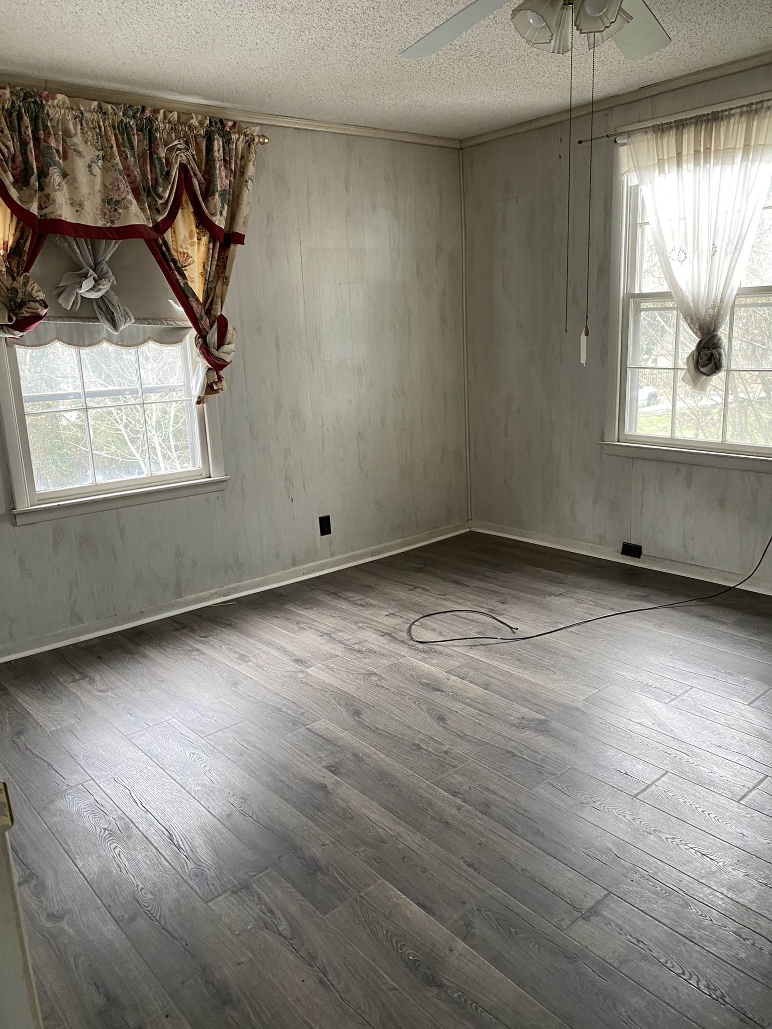 339 West Washington Street Pulaski, TN 38478 - Photo 18 of 23 an empty room with wooden floor and windows