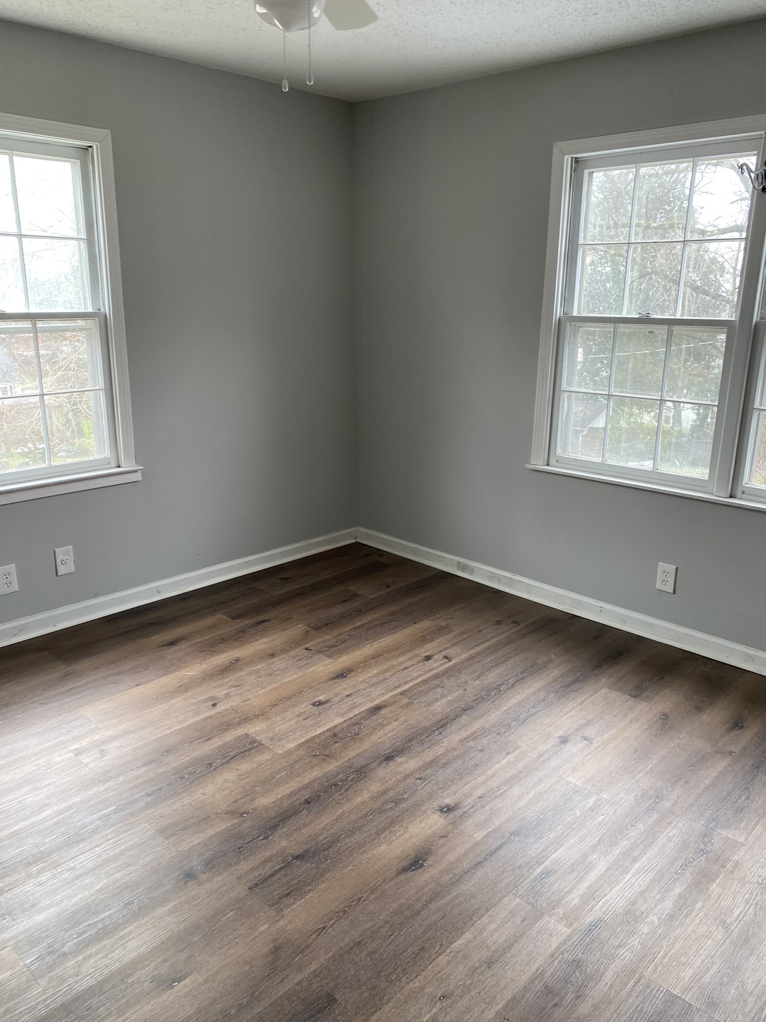 339 West Washington Street Pulaski, TN 38478 - Photo 21 of 23 an empty room with wooden floor and windows
