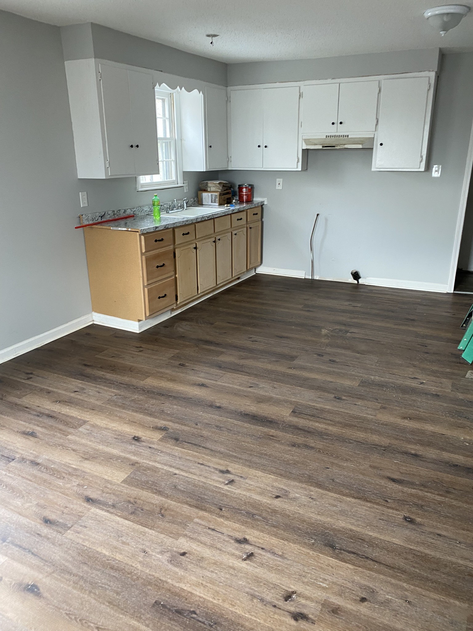 339 West Washington Street Pulaski, TN 38478 - Photo 22 of 23 a room with wooden floors and white cabinets
