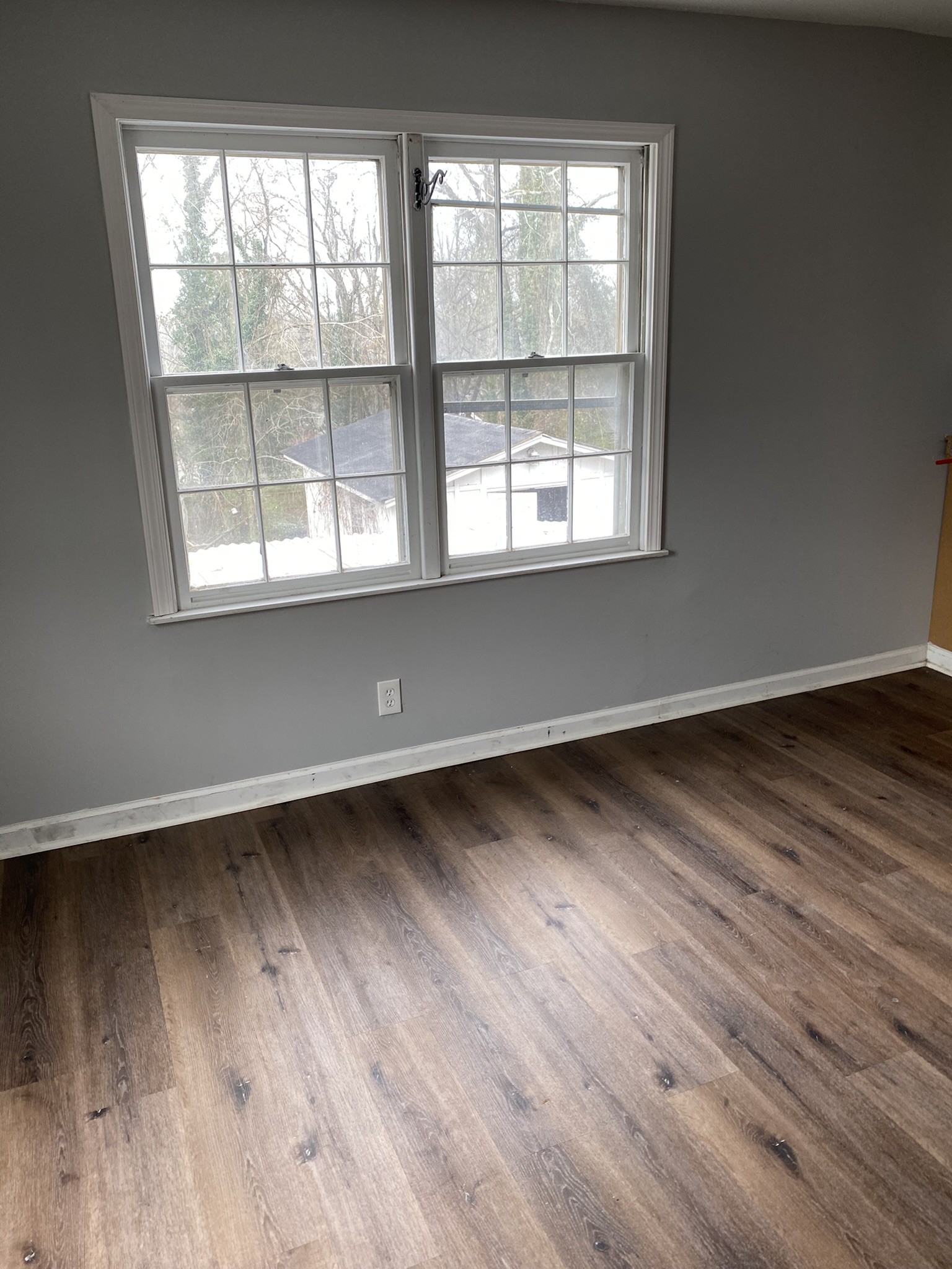 339 West Washington Street Pulaski, TN 38478 - Photo 23 of 23 an empty room with wooden floor and windows