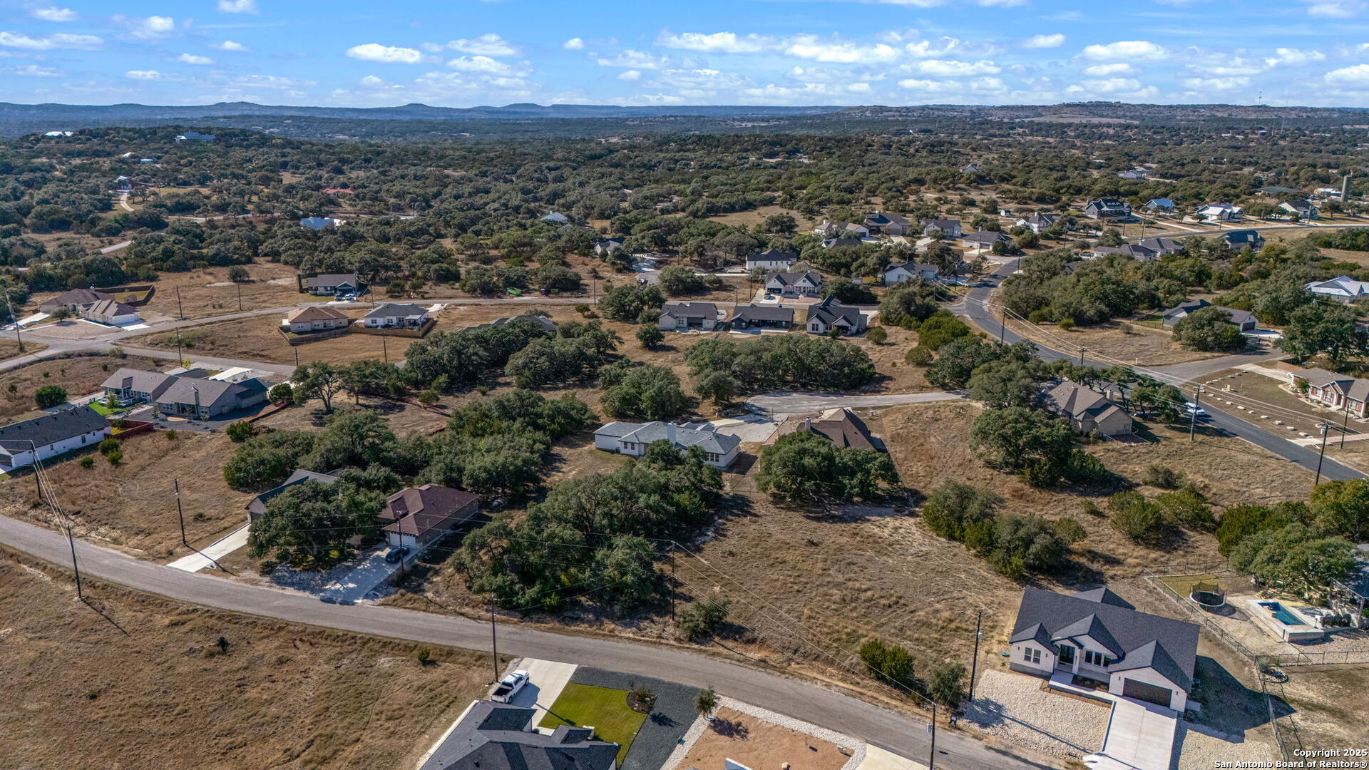 231 Peter Kleid Loop Blanco, TX 78606 - Photo 11 of 26 an aerial view of residential houses with outdoor space