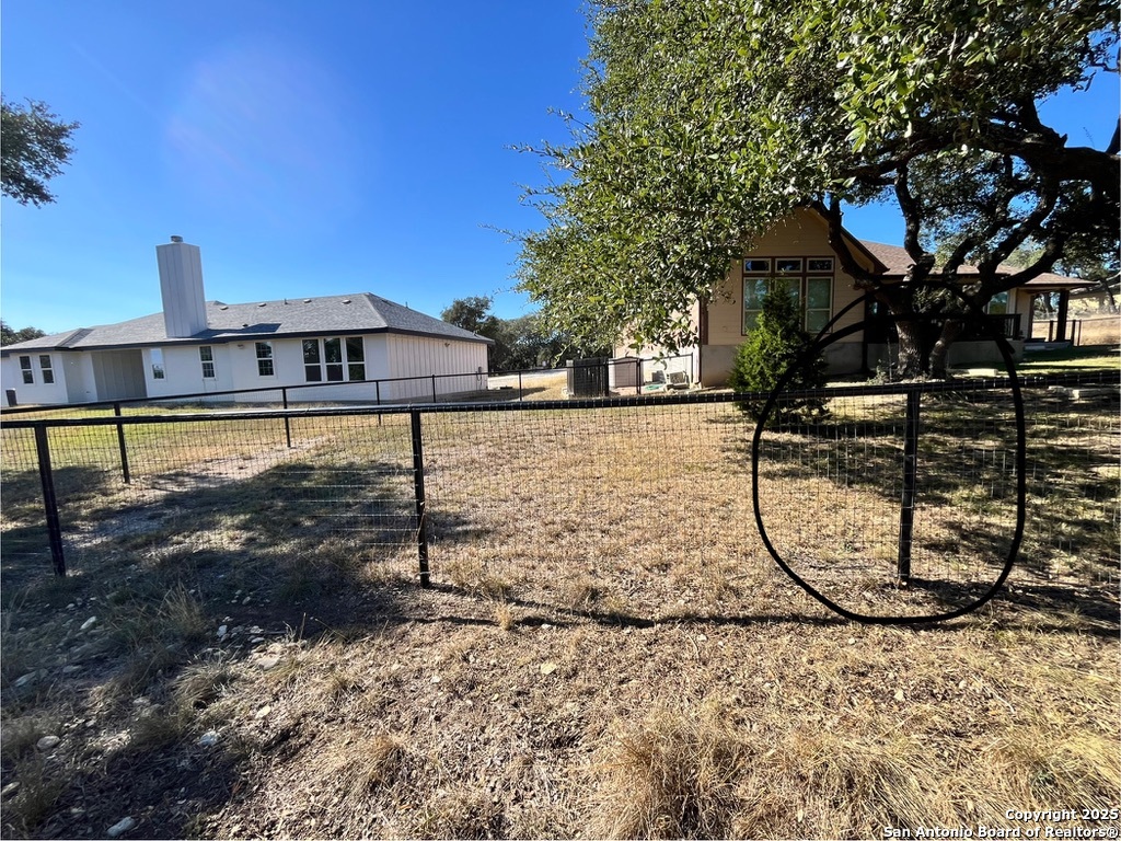 231 Peter Kleid Loop Blanco, TX 78606 - Photo 21 of 26 a view of a yard with a fountain
