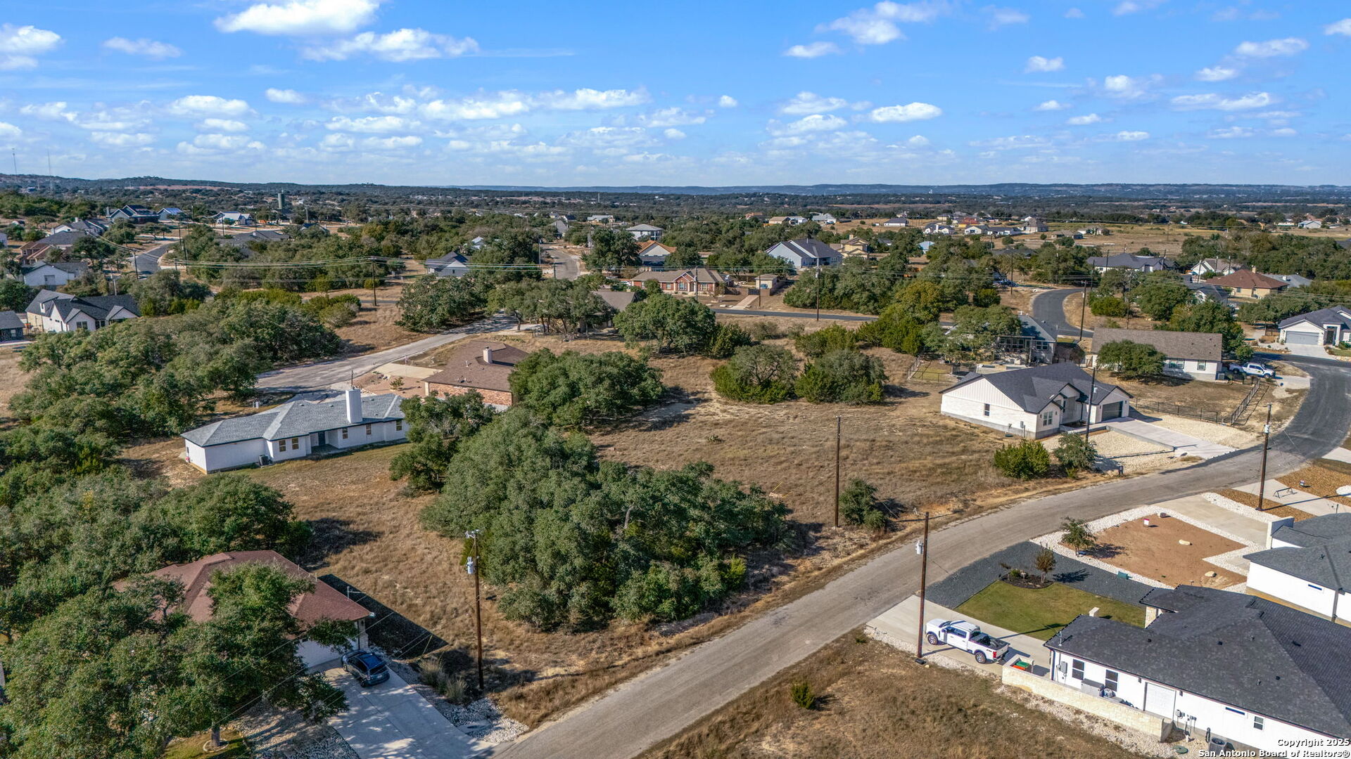 231 Peter Kleid Loop Blanco, TX 78606 - Photo 4 of 26 an aerial view of residential houses with outdoor space