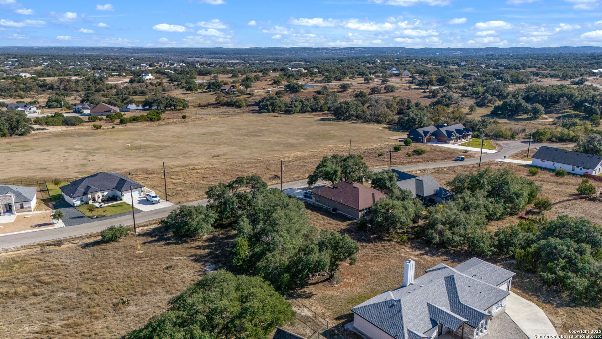 231 Peter Kleid Loop Blanco, TX 78606 - Photo 7 of 26 an aerial view of a house with a lake view