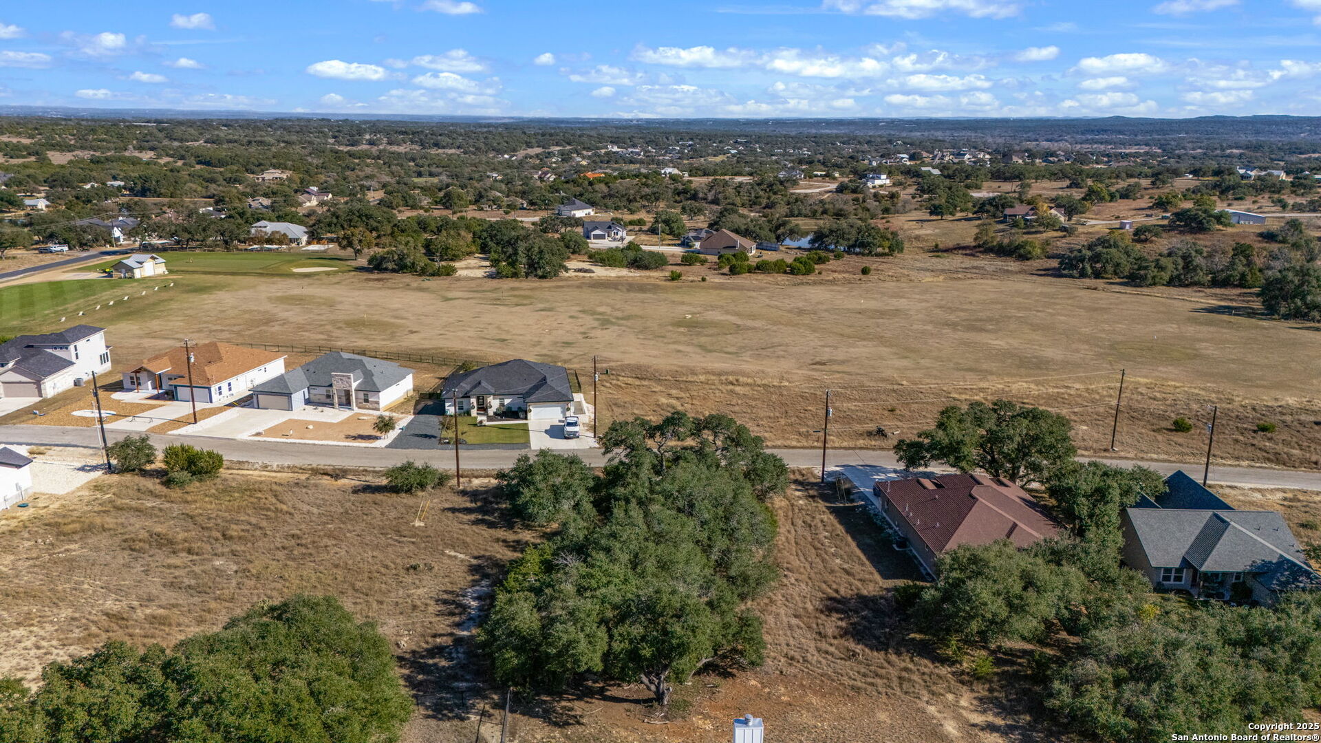 231 Peter Kleid Loop Blanco, TX 78606 - Photo 8 of 26 an aerial view of a house with a lake view
