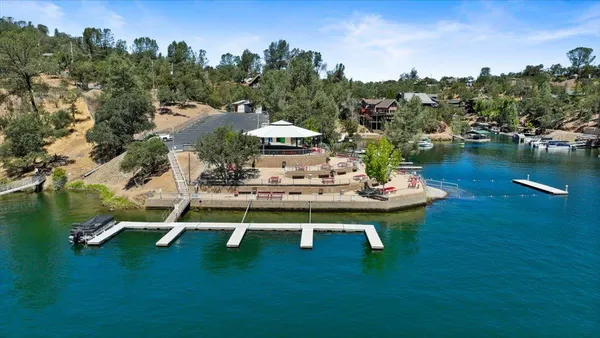 a view of a lake with lots of residential buildings ocean and mountain view
