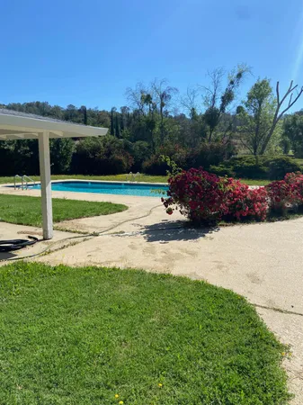 a view of a yard with an outdoor space