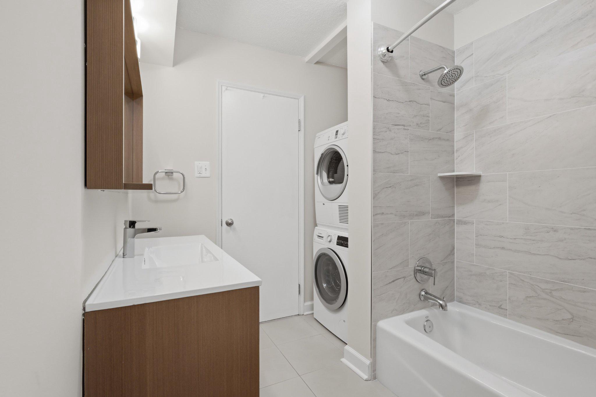 1101 St Paul Street, Unit 1212 Baltimore, MD 21202 - Photo 28 of 36 Modern hall bathroom with laundry.