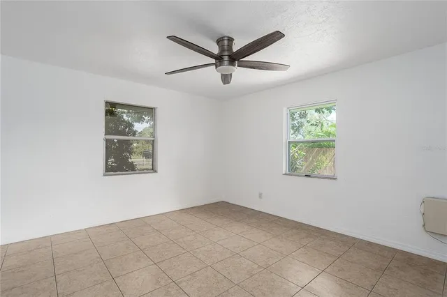 a view of a ceiling fan and a window