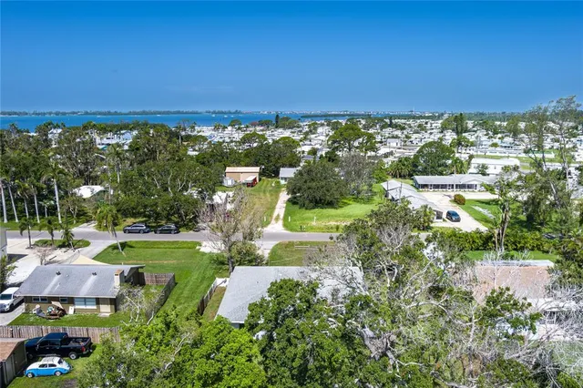 a view of a lake with houses in the back