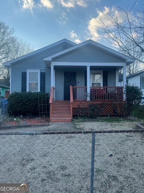 823 Humphries Street Southwest Atlanta, GA 30310 - Photo 1 of 1 a front view of a house with garden