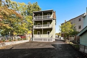 348 Centre Street, Unit 3 Boston, MA 02130 - Photo 16 of 17 a front view of a building with a yard