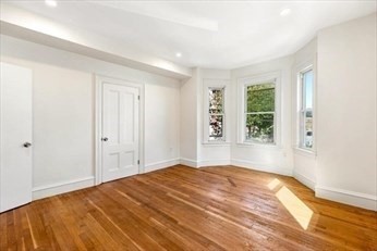 348 Centre Street, Unit 3 Boston, MA 02130 - Photo 3 of 17 a bedroom with a bed and a window