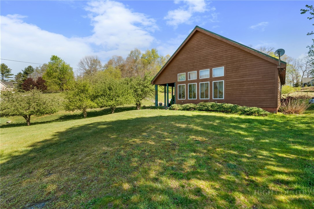 143 Lena Way Jefferson, NC 28640 - Photo 27 of 38 a front view of house with yard and green space