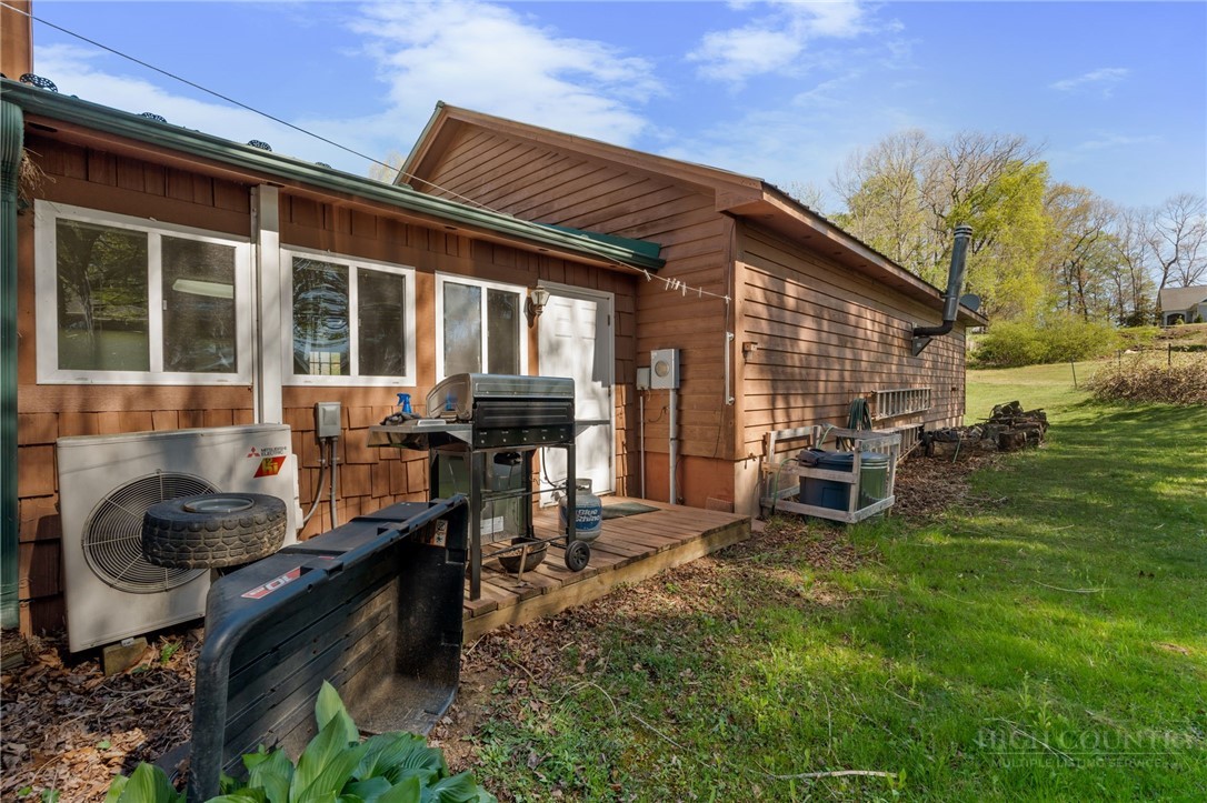 143 Lena Way Jefferson, NC 28640 - Photo 29 of 38 a view of a house with backyard barbeque and sitting area