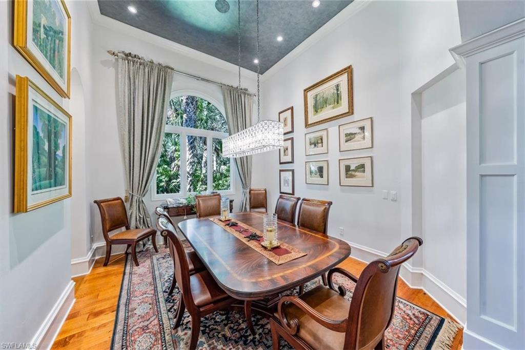 18051 Lagos Way Naples, FL 34110 - Photo 13 of 26 a view of a dining room with furniture window and outside view