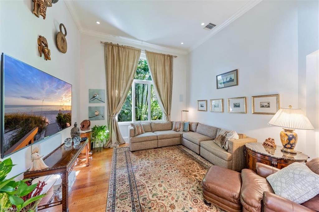 18051 Lagos Way Naples, FL 34110 - Photo 14 of 26 a living room with furniture and a large window