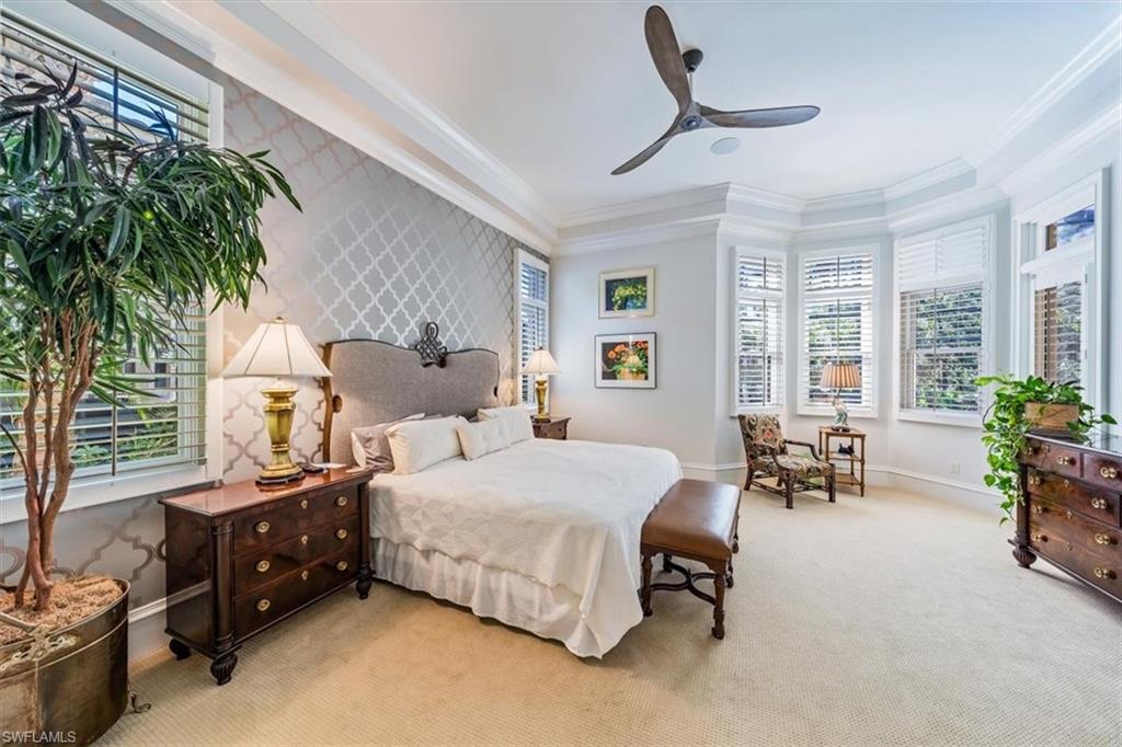 18051 Lagos Way Naples, FL 34110 - Photo 17 of 26 a bedroom with furniture and a large window