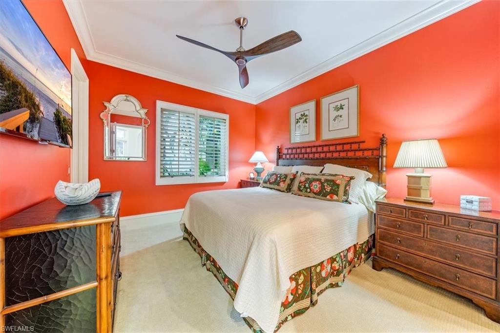 18051 Lagos Way Naples, FL 34110 - Photo 22 of 26 a bedroom with a bed and a window