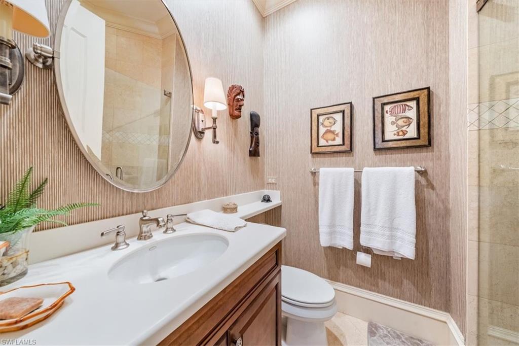 18051 Lagos Way Naples, FL 34110 - Photo 23 of 26 a bathroom with a sink toilet and a mirror