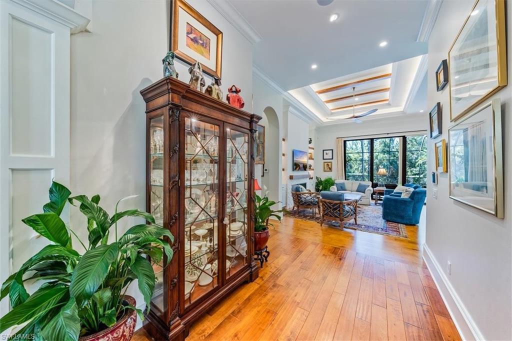 18051 Lagos Way Naples, FL 34110 - Photo 4 of 26 a living room with furniture and a potted plant