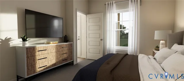 a bedroom with a bed and a flat tv screen on dresser