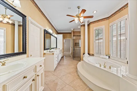 a large spacious bathroom with a large tub and sink