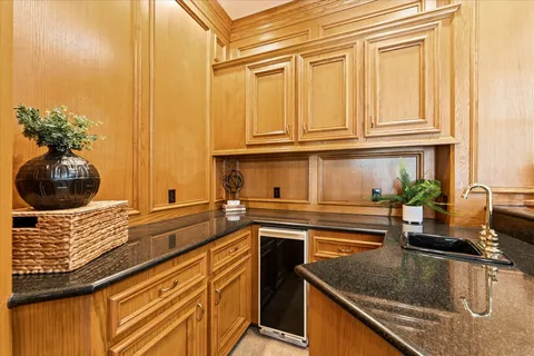 a kitchen with stainless steel appliances granite countertop a sink and a cabinets