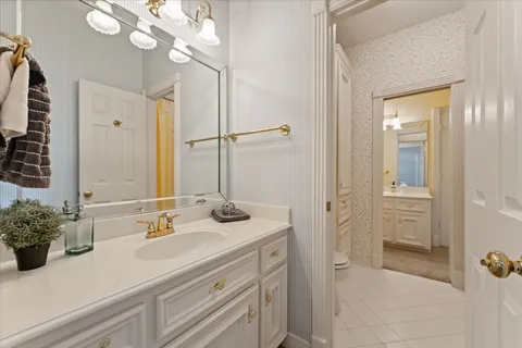 a bathroom with a sink a vanity and a mirror