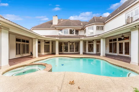 a view of a house with a swimming pool