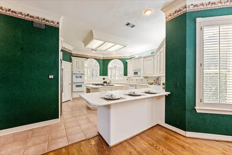 a kitchen with a sink and cabinets