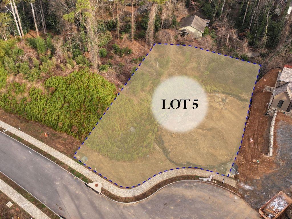 a view of a swimming pool with a yard