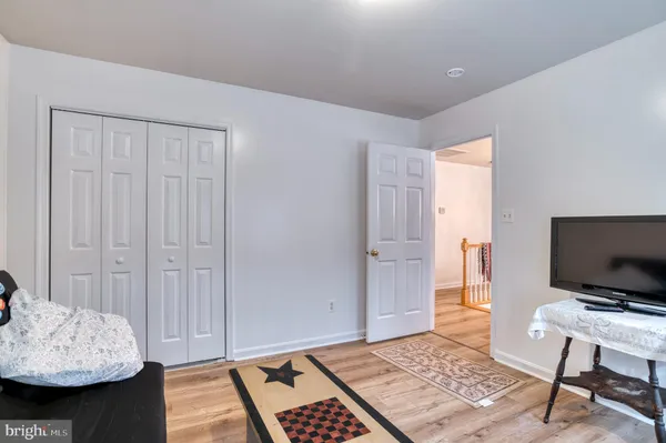 a living room with furniture and a piano