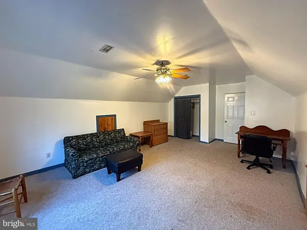 a view of a house with backyard swimming pool and sitting area