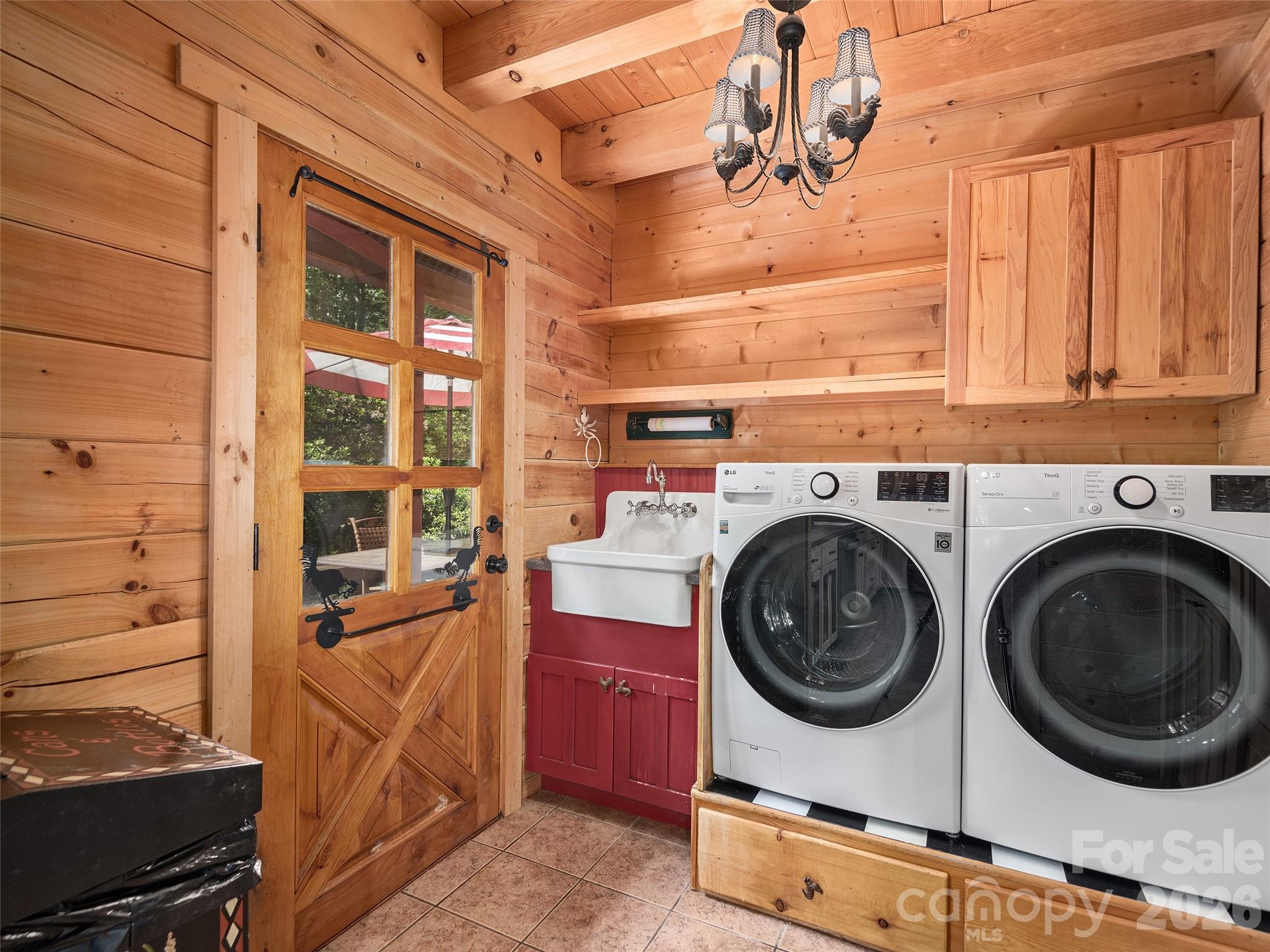 413 Green Hills Road Mill Spring, NC 28756 - Photo 22 of 48 a utility room with dryer and washer